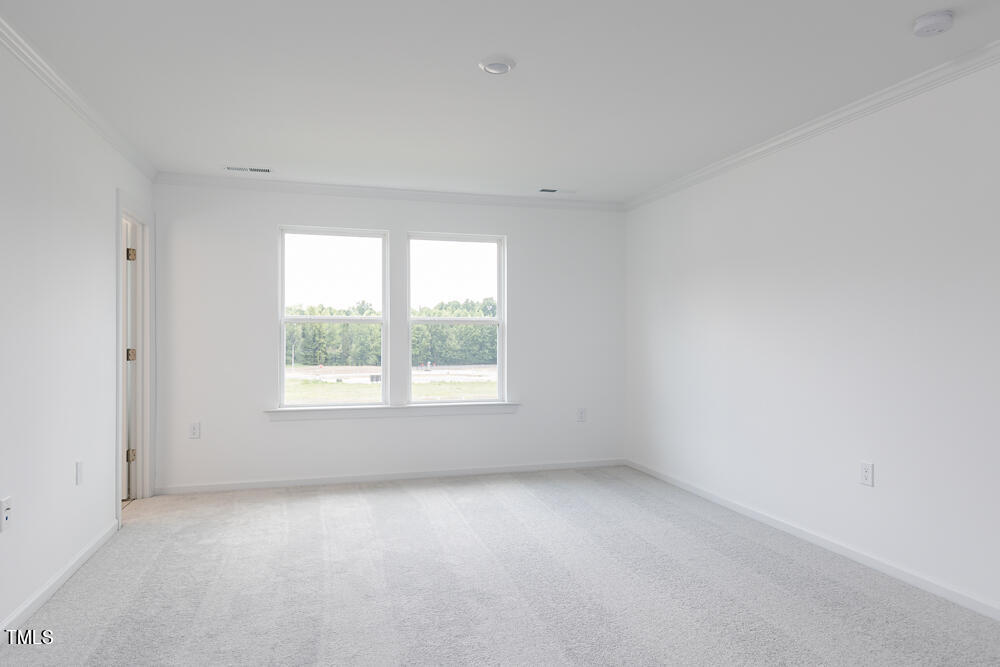 161 Charlie Smith Road Angier, NC 27501 - Photo 16 of 57 an empty room with a window