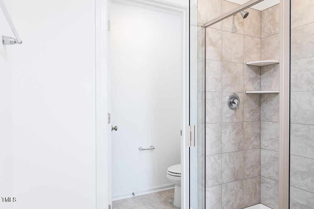 161 Charlie Smith Road Angier, NC 27501 - Photo 20 of 57 a bathroom with a shower and a toilet