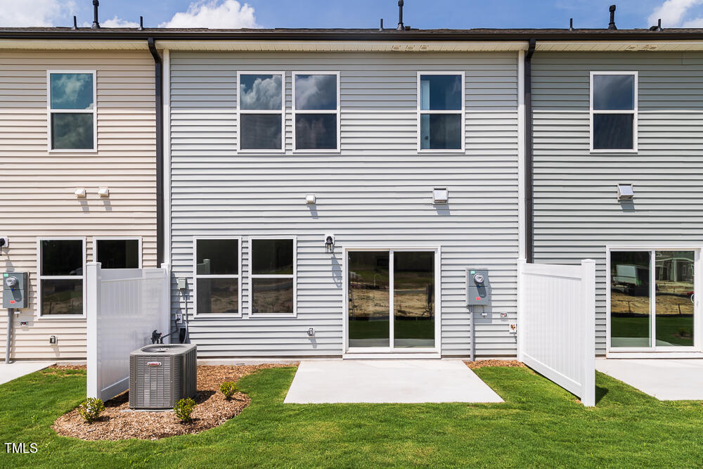 161 Charlie Smith Road Angier, NC 27501 - Photo 28 of 57 a front view of a house with a yard