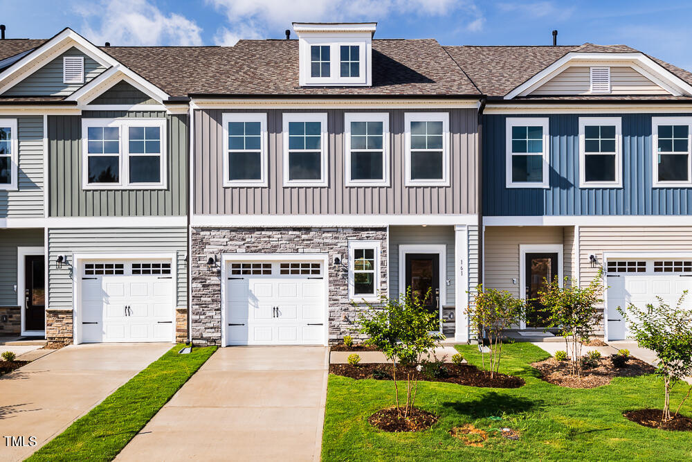 161 Charlie Smith Road Angier, NC 27501 - Photo 30 of 57 a front view of a house with a yard