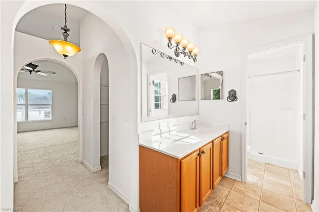 a view of a living room with a ceiling fan