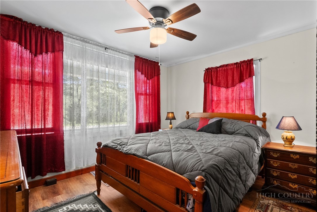 154 Folger Road Sparta, NC 28675 - Photo 13 of 37 a bedroom with a bed and window