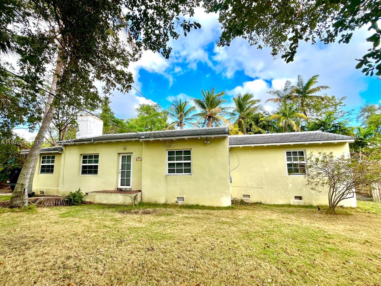 901 Northwest 10th Court Miami, FL 33136 - Photo 1 of 13 front view of a house with a yard