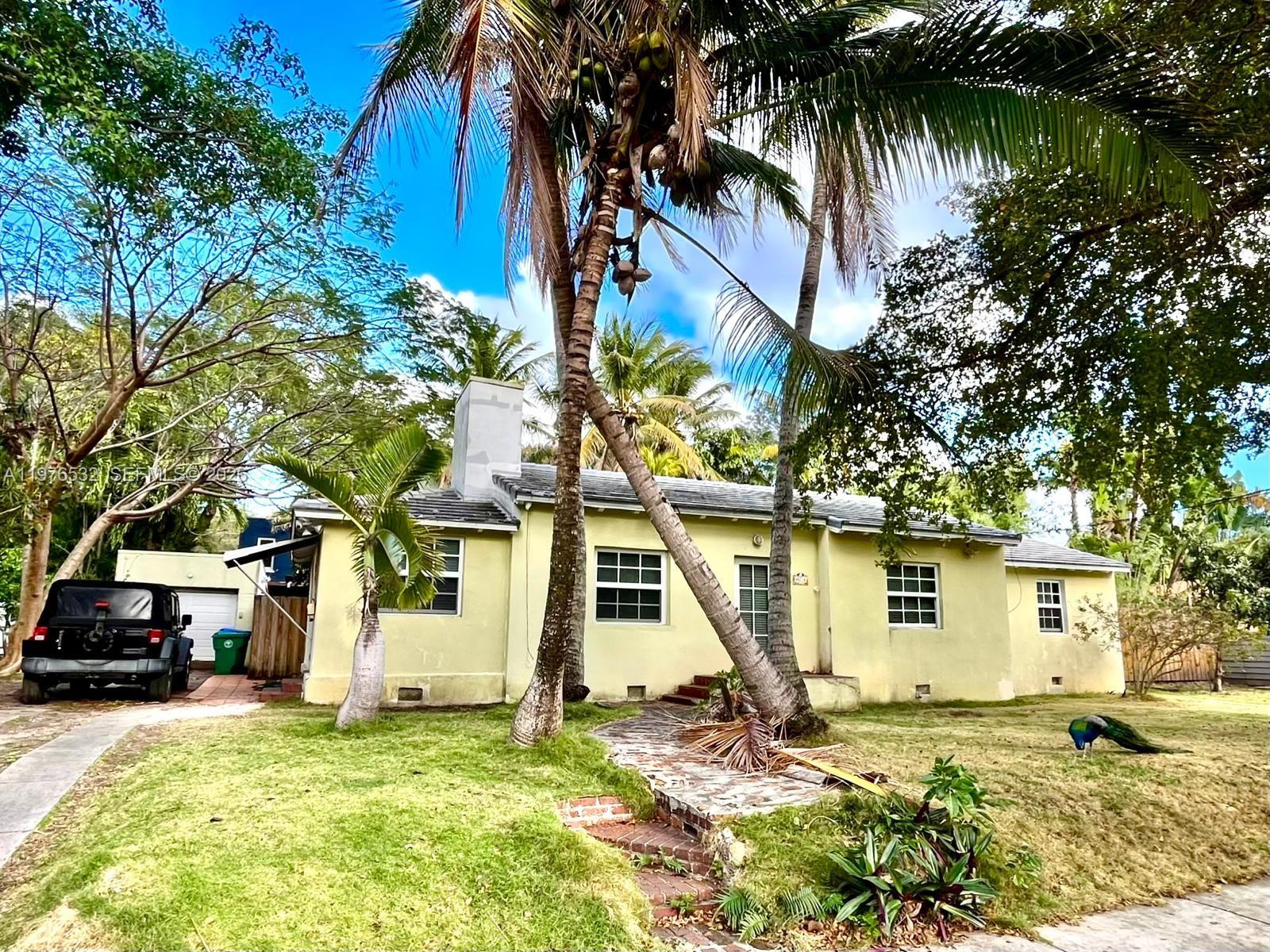 901 Northwest 10th Court Miami, FL 33136 - Photo 2 of 13 a view of a house with a yard