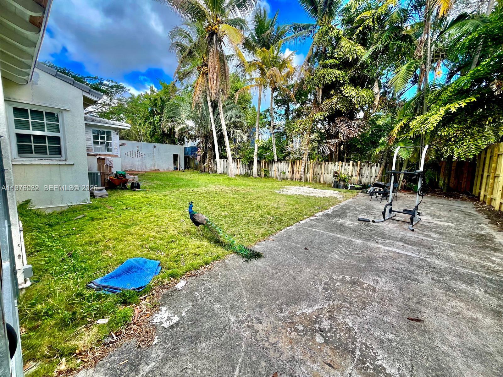 901 Northwest 10th Court Miami, FL 33136 - Photo 7 of 13 a view of a backyard with a garden and fire pit