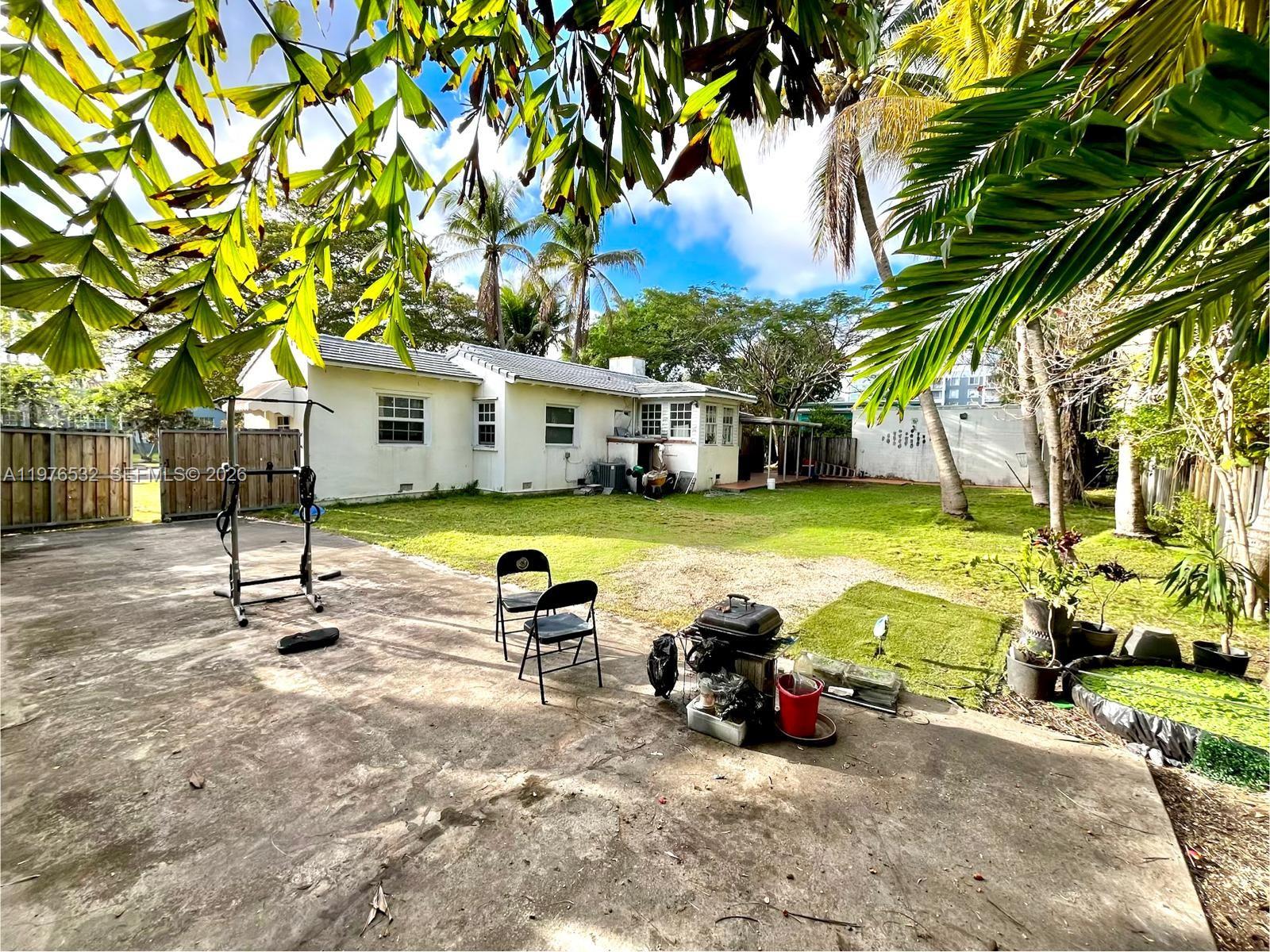 901 Northwest 10th Court Miami, FL 33136 - Photo 8 of 13 a view of a house with backyard porch and sitting area