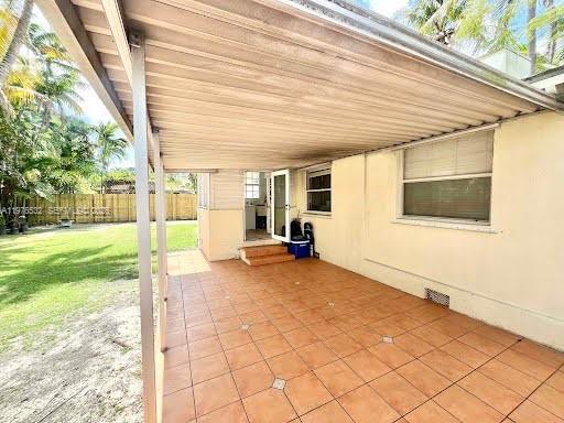 901 Northwest 10th Court Miami, FL 33136 - Photo 10 of 13 a view of a house with backyard and sitting area
