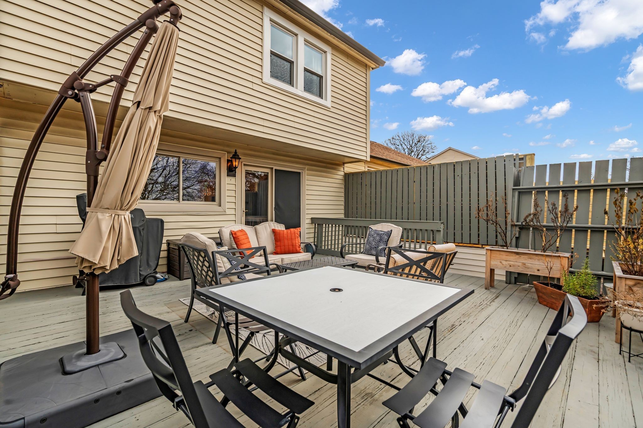 318 Huntington Ridge Drive Nashville, TN 37211 - Photo 26 of 29 a view of a patio with table and chairs with wooden floor and fence
