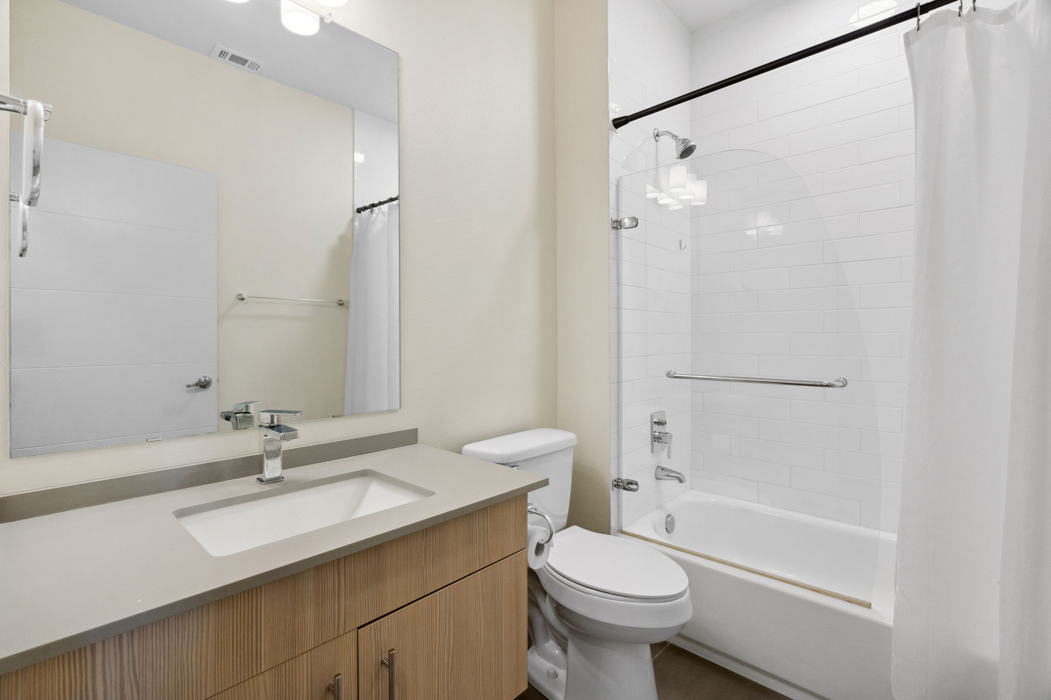 7805 Cooper Lane, Unit 606 Austin, TX 78745 - Photo 22 of 35 a bathroom with a granite countertop sink toilet and shower