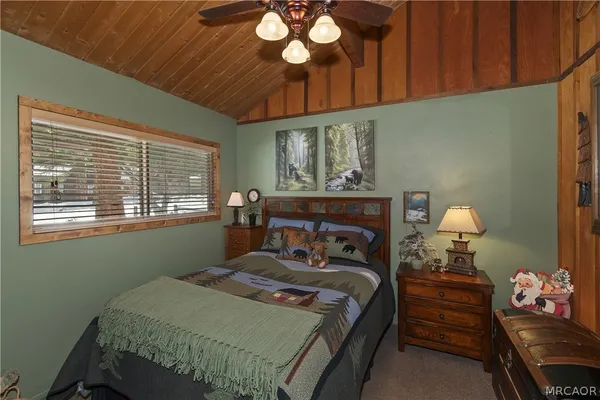 a bed room with furniture and a window