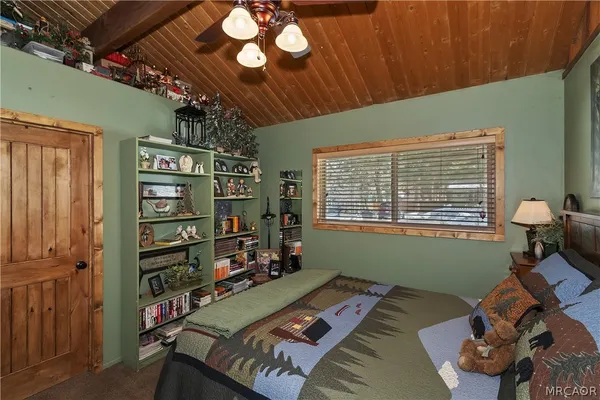 a bedroom with furniture and a window