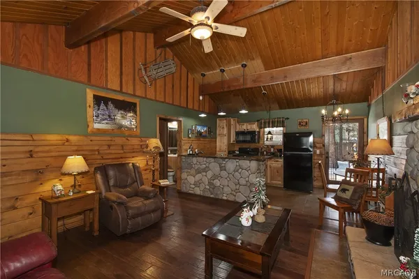 a kitchen with furniture and a fireplace