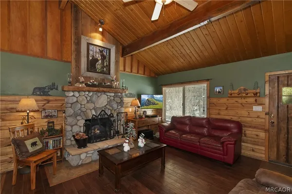a kitchen with stainless steel appliances kitchen island granite countertop a refrigerator stove and microwave