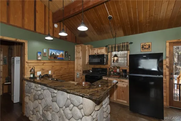 a kitchen with a stove and a microwave