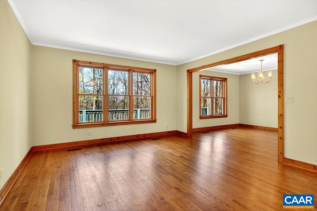 472 Horseshoe Mountain Road Roseland, VA 22967 - Photo 13 of 75 a view of an empty room with wooden floor and a window