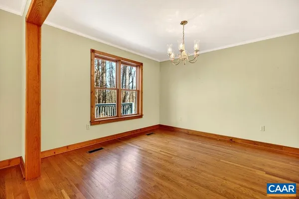 a kitchen with stainless steel appliances granite countertop a sink a stove and cabinets