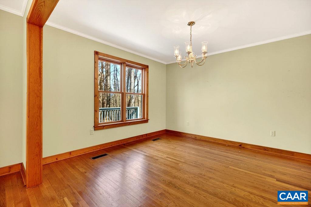 472 Horseshoe Mountain Road Roseland, VA 22967 - Photo 14 of 75 a view of an empty room with wooden floor and a window