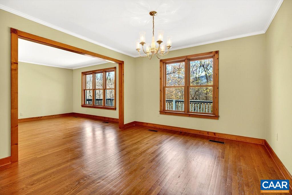 472 Horseshoe Mountain Road Roseland, VA 22967 - Photo 15 of 75 a view of an empty room with wooden floor and a window