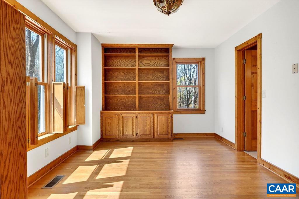 472 Horseshoe Mountain Road Roseland, VA 22967 - Photo 28 of 75 a view of an empty room with wooden floor and a window