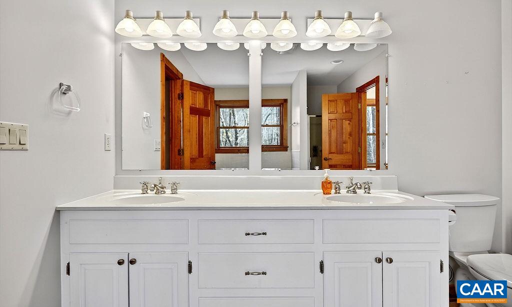 472 Horseshoe Mountain Road Roseland, VA 22967 - Photo 35 of 75 a bathroom with a sink mirror and double