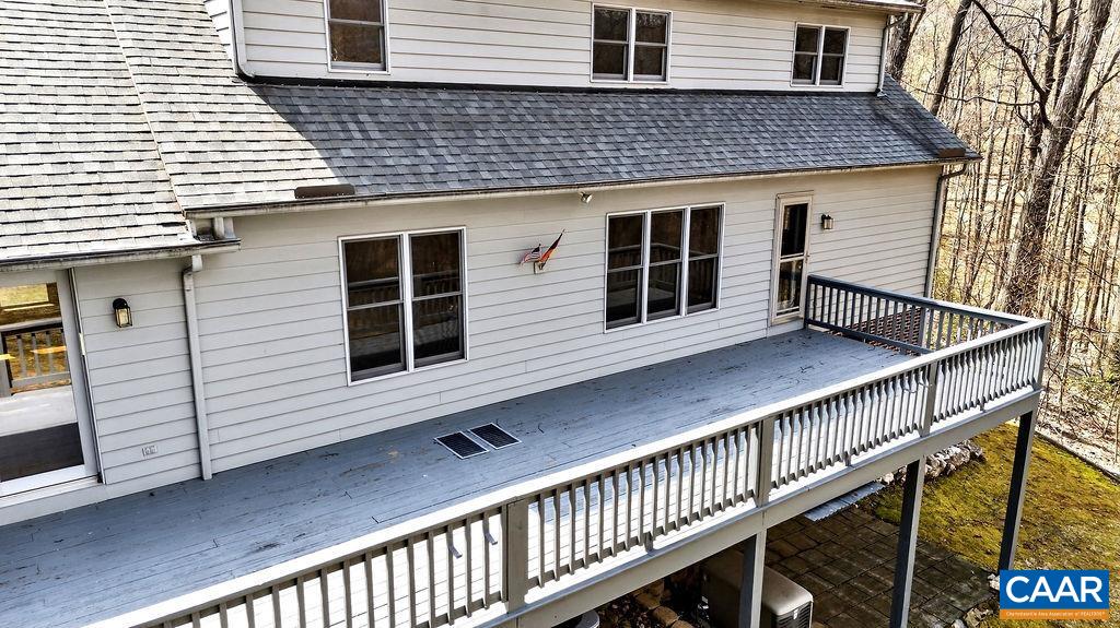 472 Horseshoe Mountain Road Roseland, VA 22967 - Photo 40 of 75 a view of house with wooden stairs and a large window