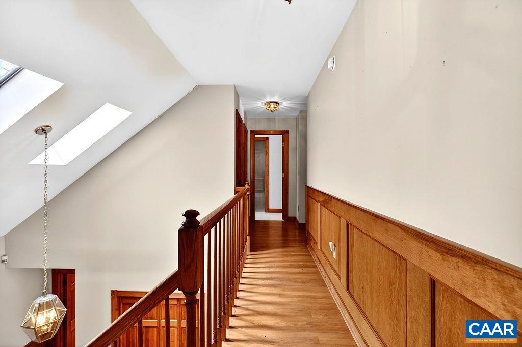 472 Horseshoe Mountain Road Roseland, VA 22967 - Photo 46 of 75 a view of a hallway with wooden floor and stairs