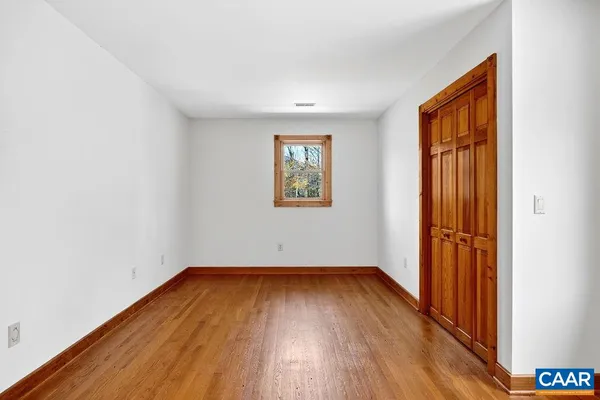 a view of room with stairs and a window