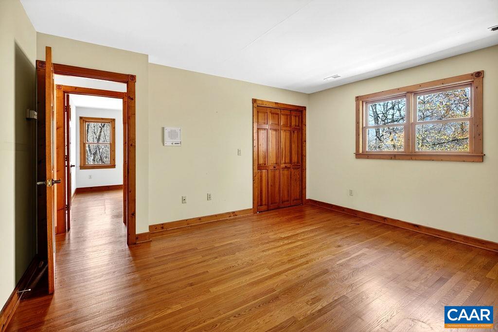 472 Horseshoe Mountain Road Roseland, VA 22967 - Photo 53 of 75 a view of an empty room with wooden floor and a window