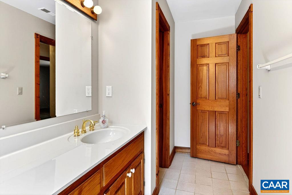 472 Horseshoe Mountain Road Roseland, VA 22967 - Photo 60 of 75 a bathroom with a sink and a mirror