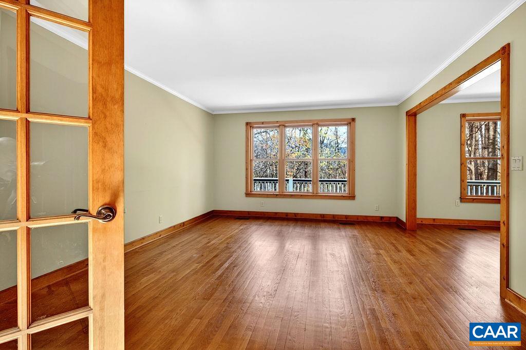 472 Horseshoe Mountain Road Roseland, VA 22967 - Photo 9 of 75 an empty room with wooden floor and windows