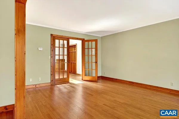 a kitchen with stainless steel appliances granite countertop a sink a stove and a wooden cabinets