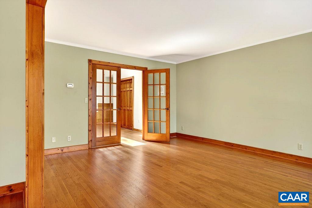 472 Horseshoe Mountain Road Roseland, VA 22967 - Photo 10 of 75 an empty room with wooden floor and windows