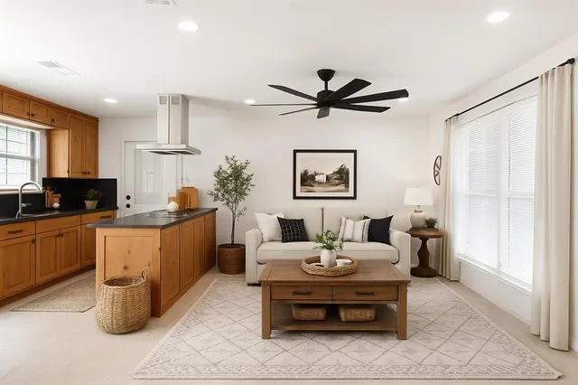 a living room with furniture and a window