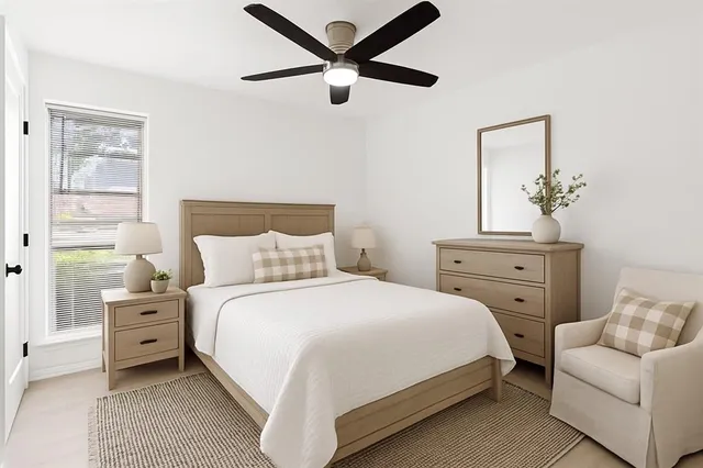 a bedroom with a bed and a couch