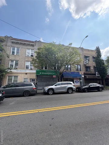 a view of street with parked cars