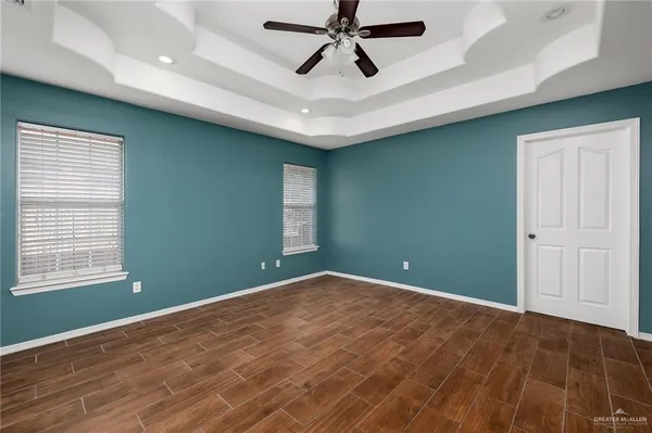 a view of room with window and ceiling fan