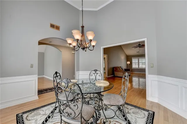 a view of room with window ceiling fan and wooden floor