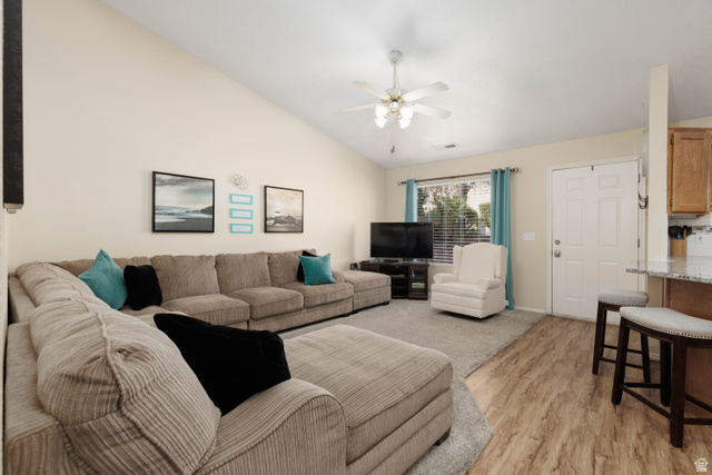 161 West 950 South, Unit S4 St. George, UT 84770 - Photo 6 of 21 Living area featuring lofted ceiling, light wood-style floors, and a ceiling fan