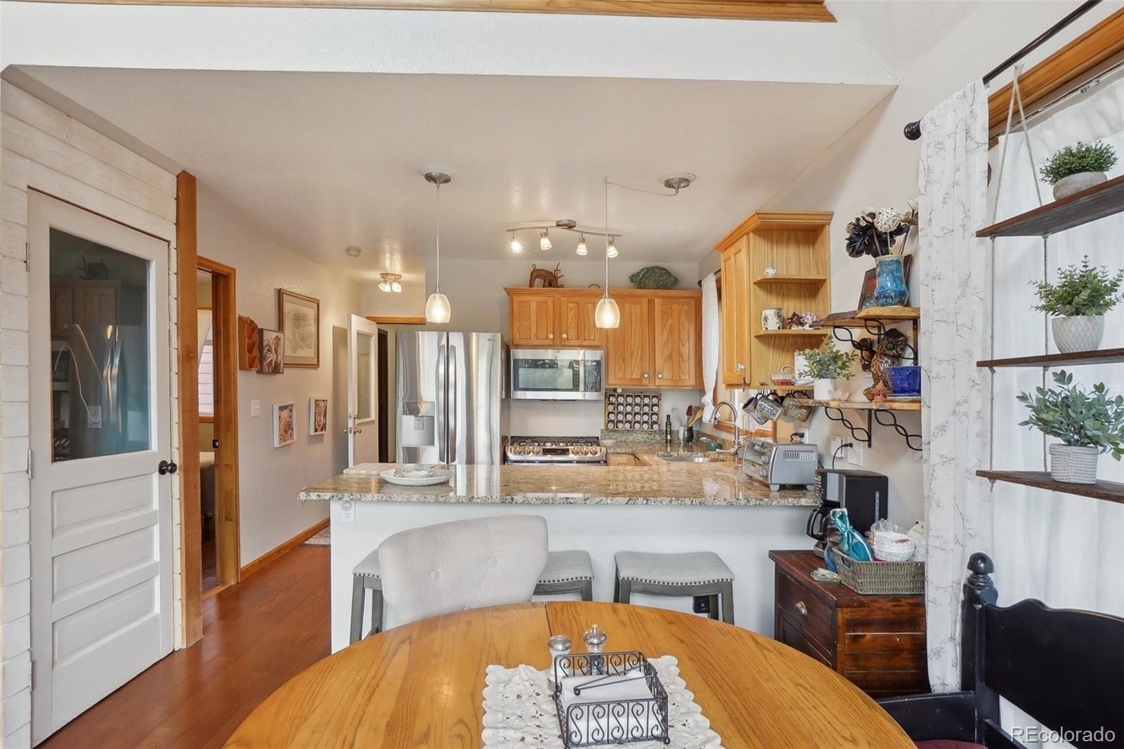 125 Aspen Road Black Hawk, CO 80422 - Photo 11 of 44 a large kitchen with a table and chairs