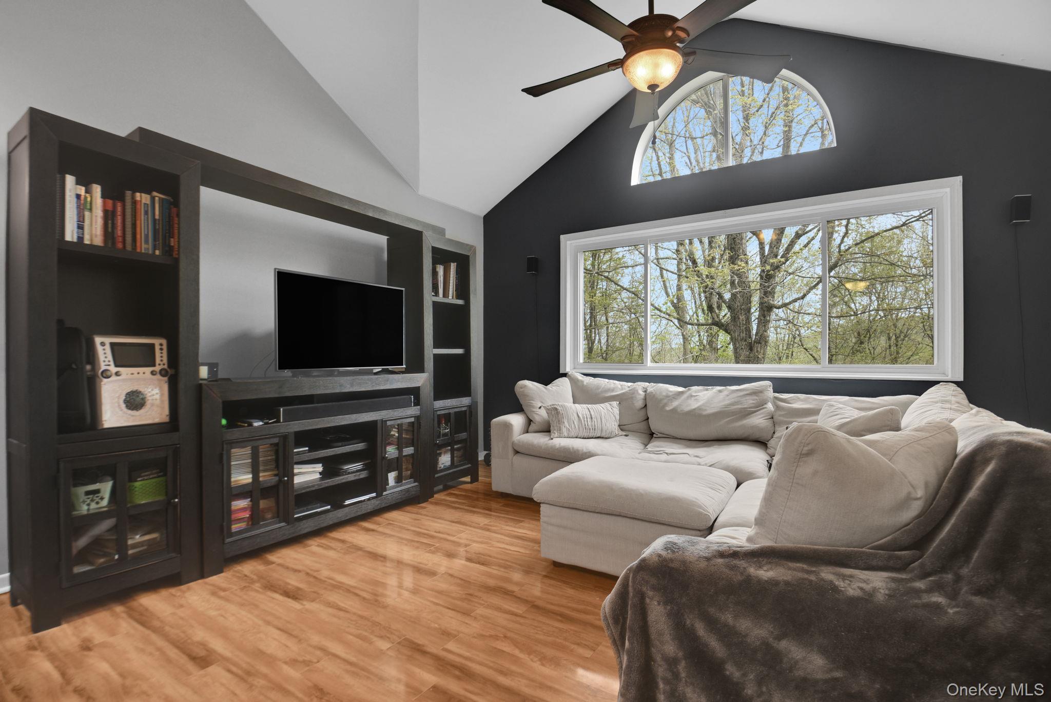 805 Eagles Ridge Road Brewster, NY 10509 - Photo 2 of 22 a living room with furniture and a flat screen tv