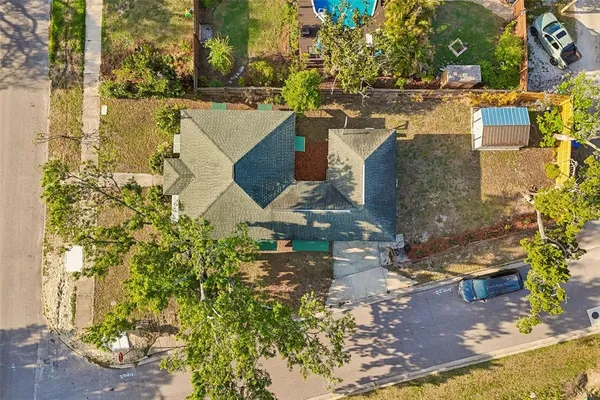 an aerial view of residential houses with outdoor space