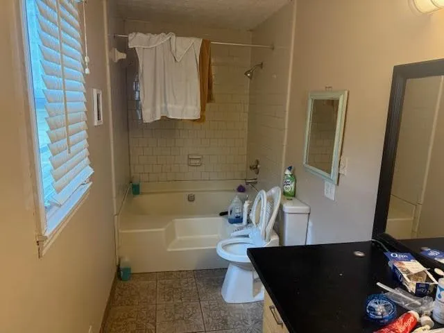 a bathroom with a bathtub and a sink