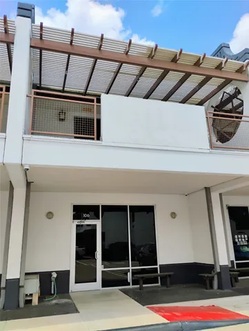 a very nice looking building with a big yard