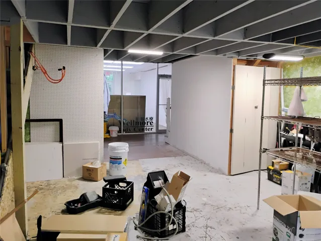 a view of a dining room with furniture and a chandelier