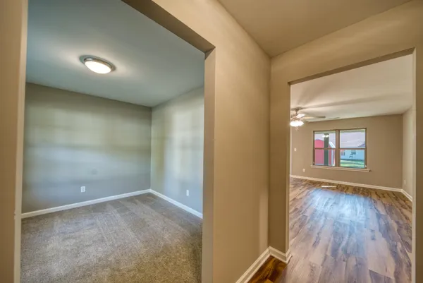 a bathroom with a granite countertop sink and a large mirror