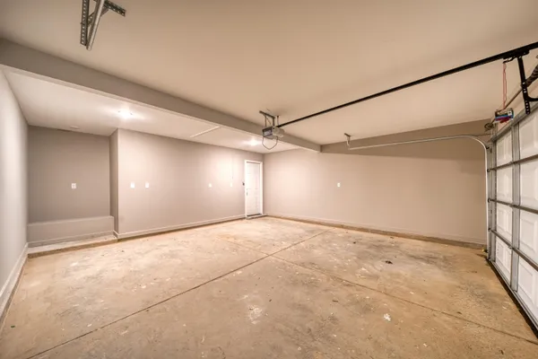 a view of a bedroom with wooden floor