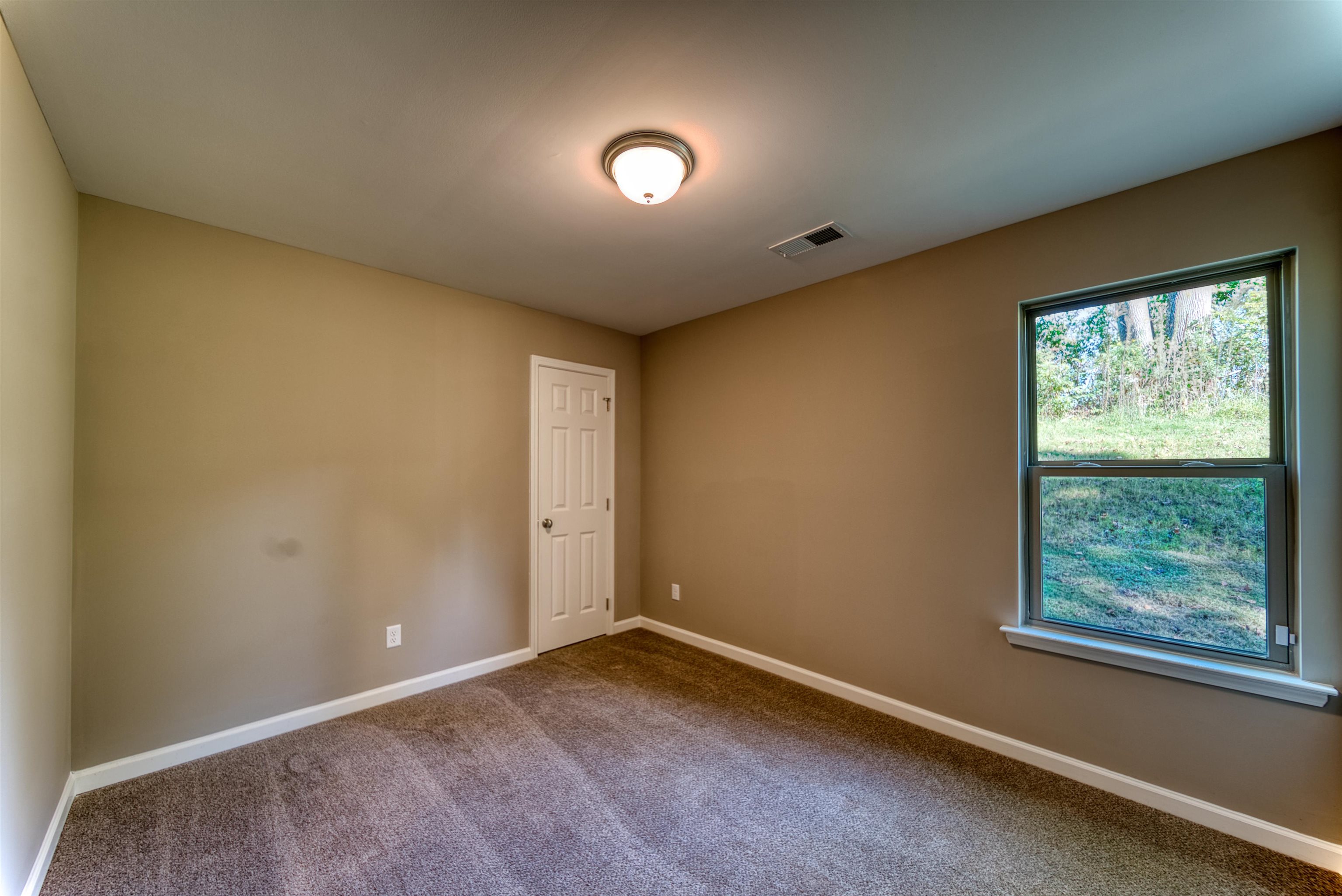 109 Walnut Ridge Ripley, TN 38063 - Photo 17 of 39 an empty room with windows