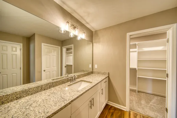 a view of a livingroom with wooden floor and closet