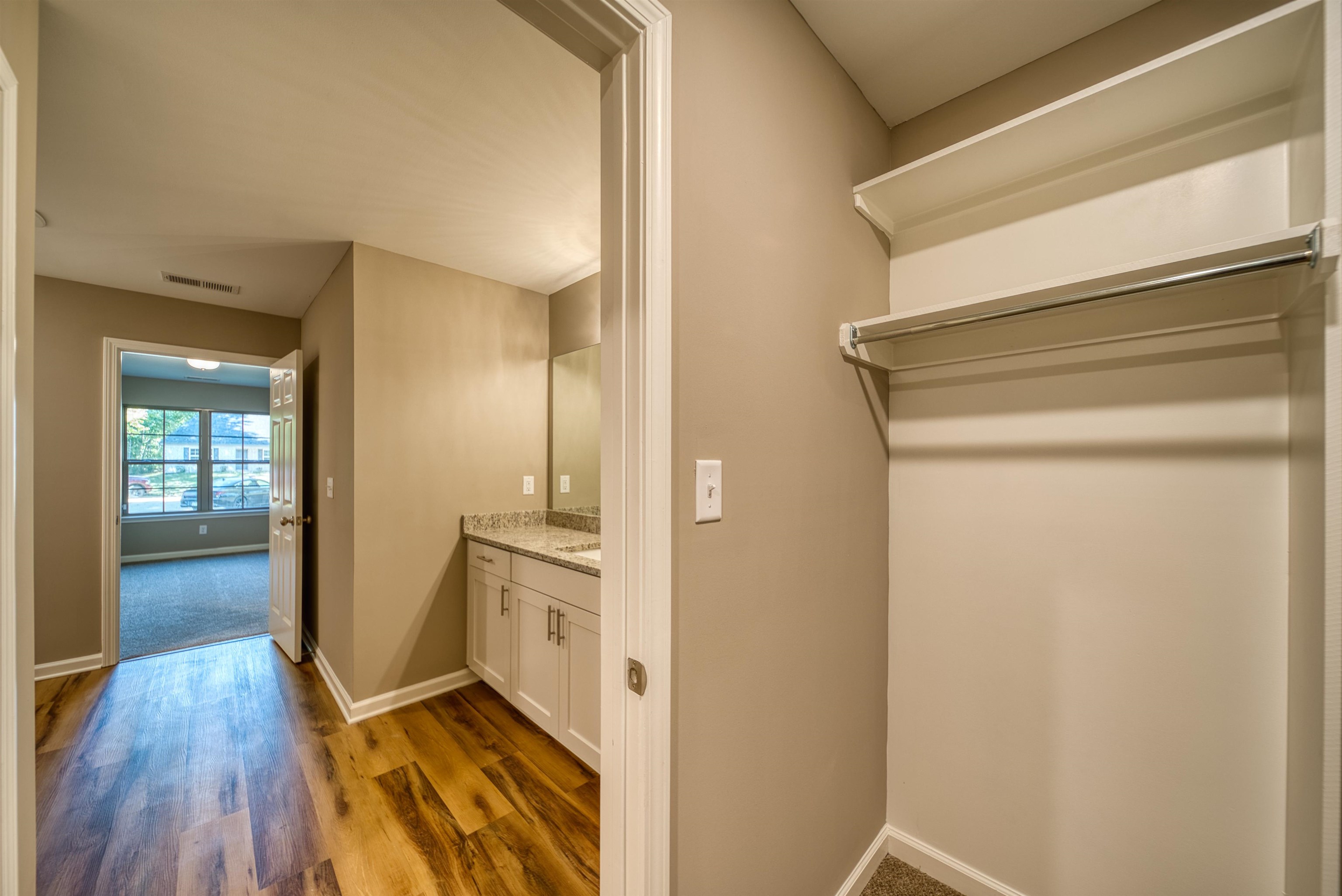 109 Walnut Ridge Ripley, TN 38063 - Photo 24 of 39 Bathroom featuring vanity and dark wood-type flooring