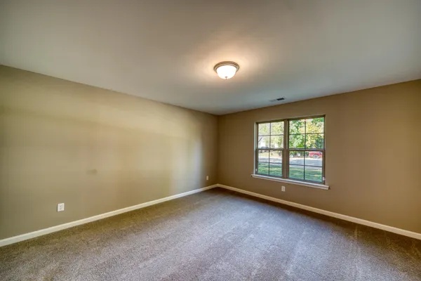 a view of kitchen with cabinets appliances and wooden floor